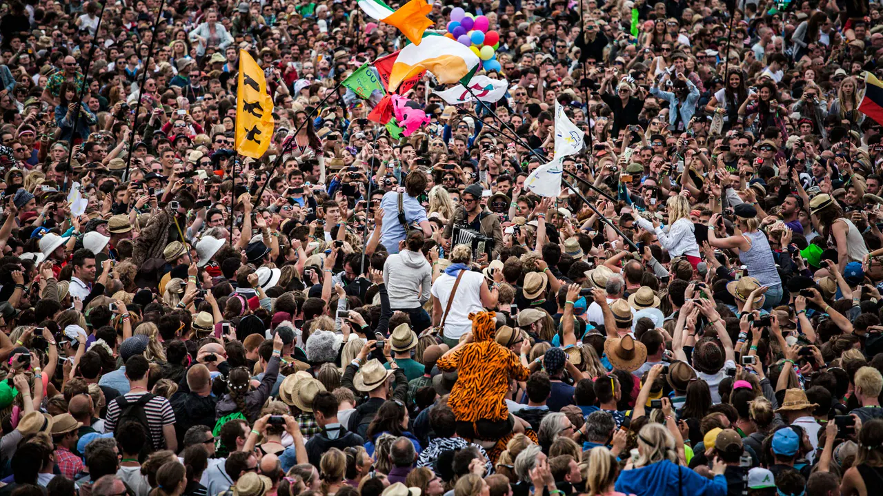 A festival crowd wearing event merch