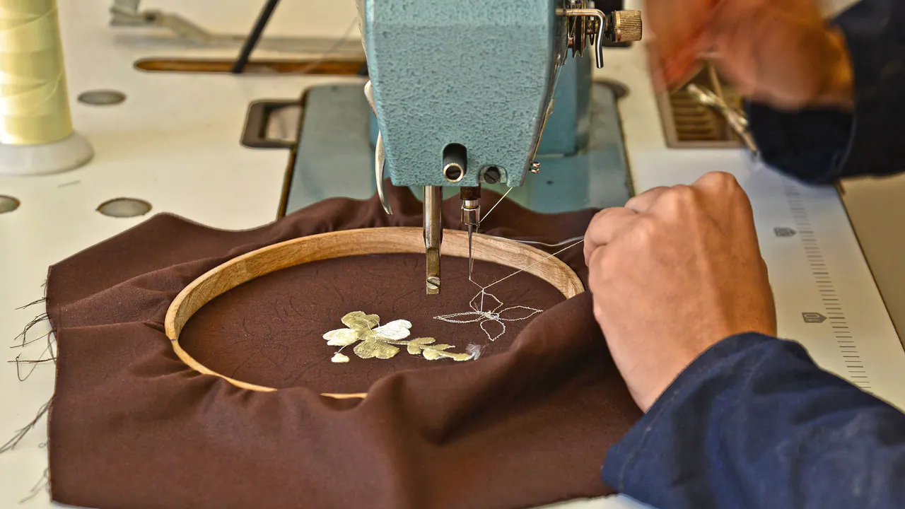 An embroidery machine stitching a design