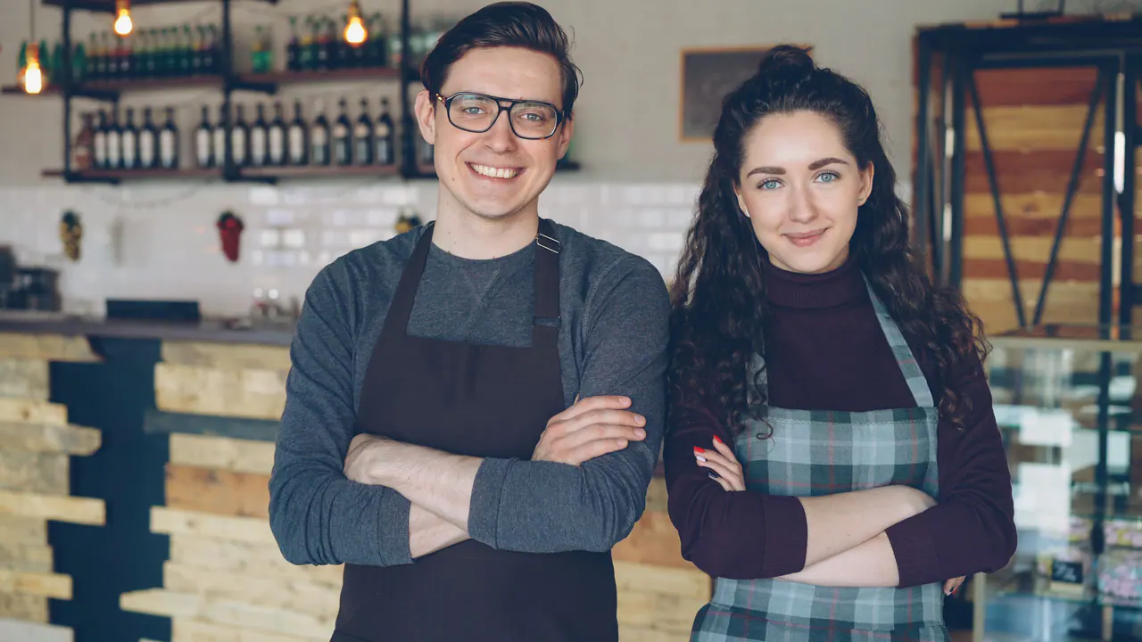 Cafe staff in aprons